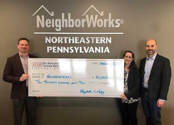 Group of HNB employees holding a check for Northeastern PA NeighborWorks