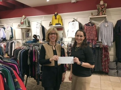 Mary Ann Lezzi and Elizabeth Nagy holding check donation for Dress for Success