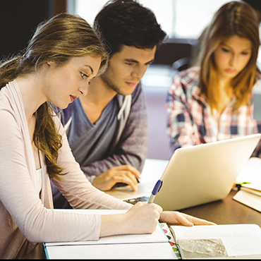 three people working at desk