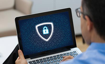 Laptop showing online security symbol.