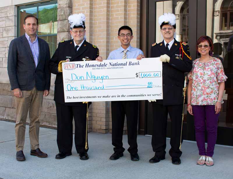 Don Nguyen accepts large check