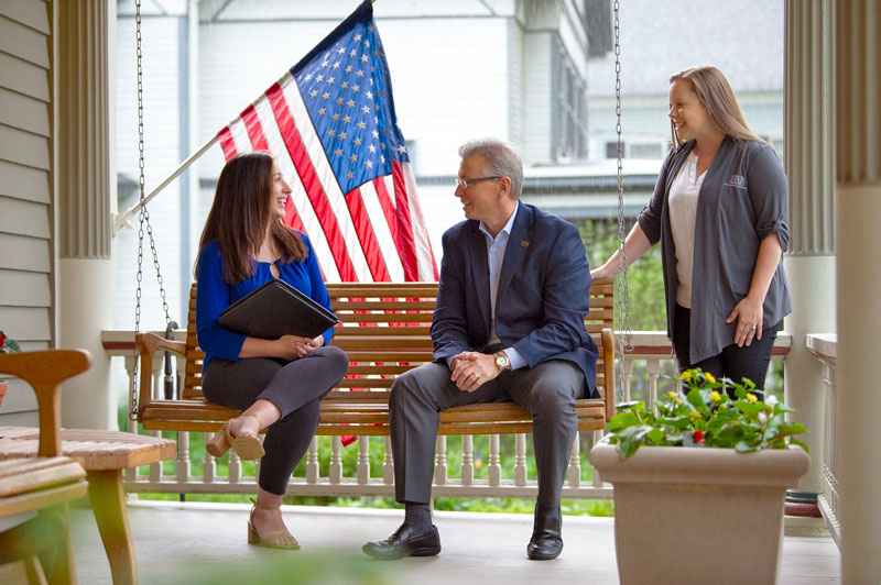 mortgage advisors sitting on porch