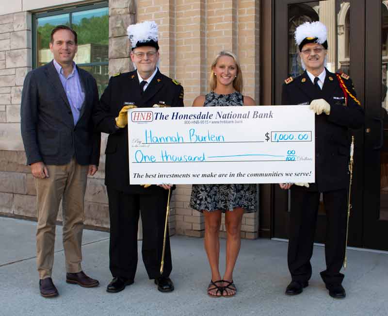 Hannah Burlein accepts large check