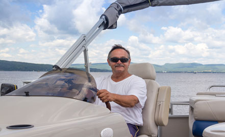 man driving boat