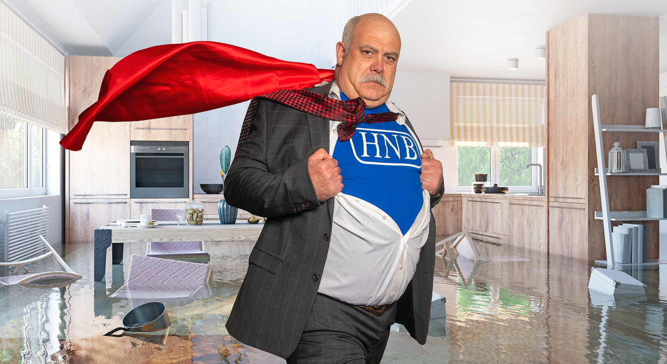 Brian Wilken donning a cape in an overflowing kitchen
